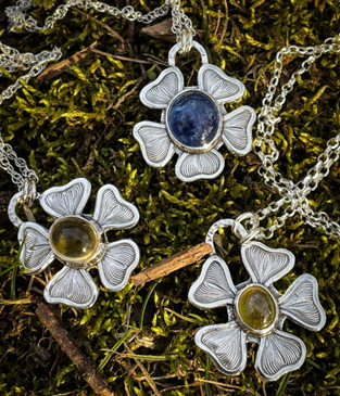 Silver flower pendant necklaces with stone center